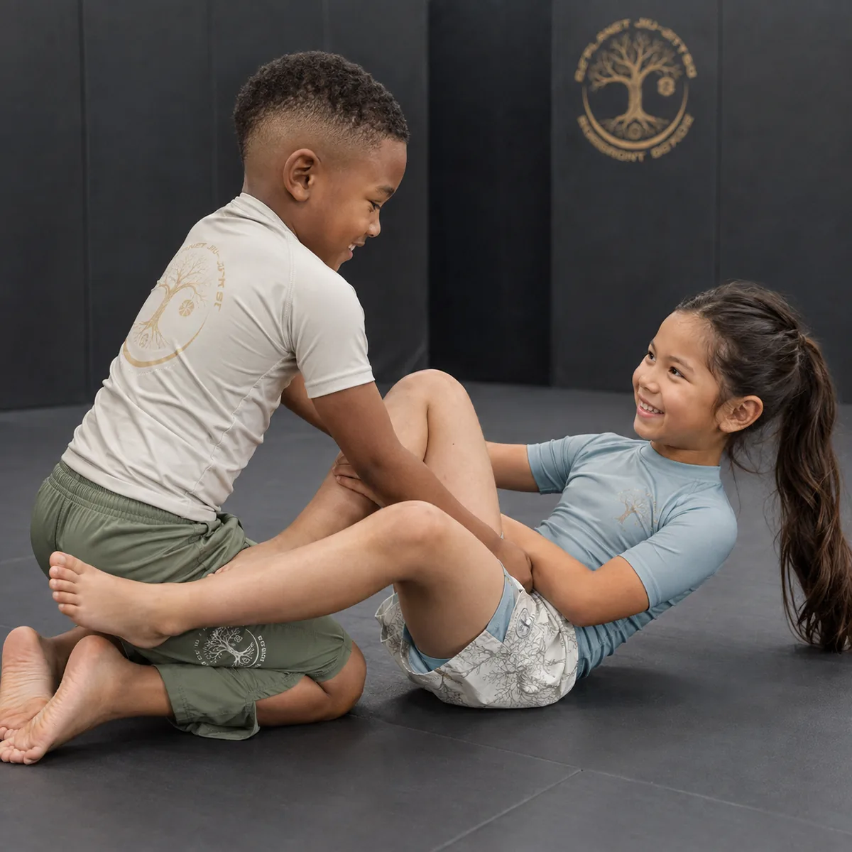 Kids partner drilling in the No-Gi Jiu Jitsu program at 10th Planet Pleasant Grove